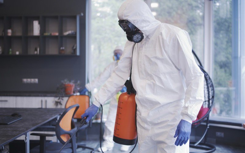 Technicians disinfecting a commercial interior