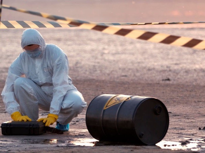 Crew containing a hazardous chemical spill