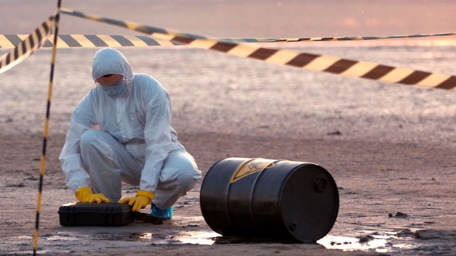 Hazmat crew containing and cleaning up a chemical spill