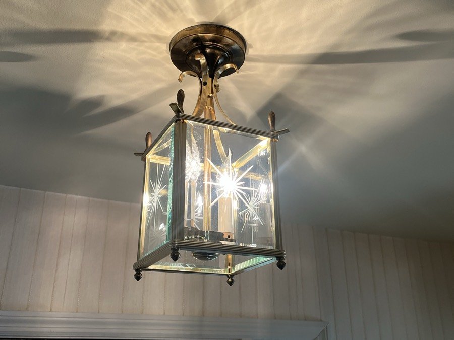 Entry light fixture cleaned until the cut glass throws a clean pattern