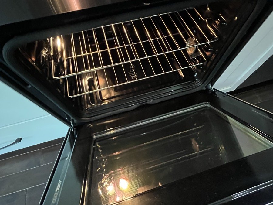 Oven cleaned inside, racks and door glass left clear