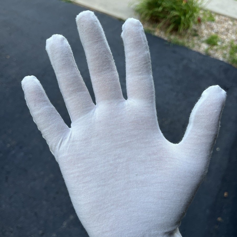 A clean white cotton glove after a White Glove inspection